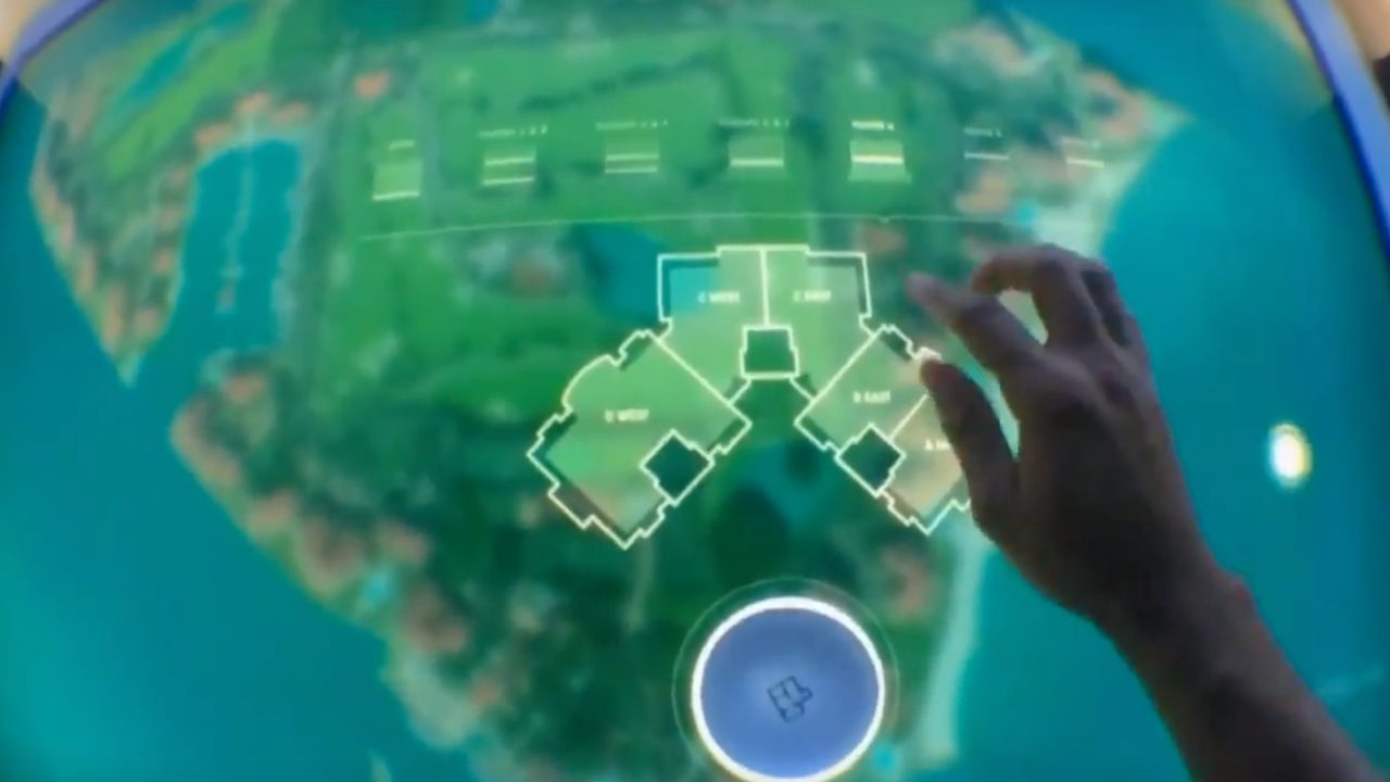 A person's hand interacting with a digital touchscreen display showing a map with highlighted areas and layout plans.