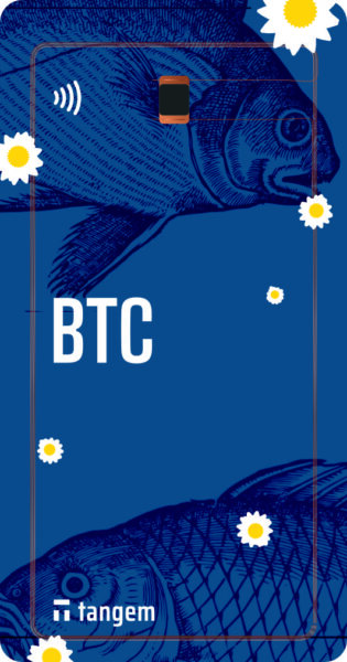 A blue card with illustrations of fish and white flowers. The text "BTC" and "Tangem" appear on the card, along with a contactless payment symbol.